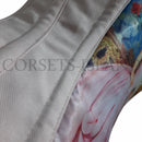 Close-up of a corset with floral design on a white background