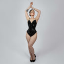 Model wearing glossy black PVC steel boned underbust corset showing hourglass waist shaping -- Daphne by Corsets Island